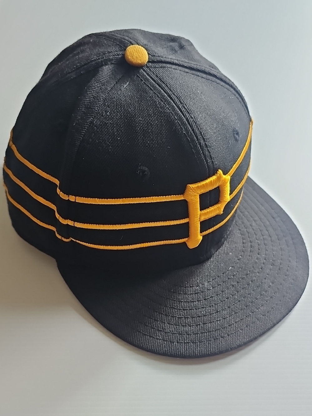 New Era Black Baseball Cap with Gold 'P' and Triple Stripe